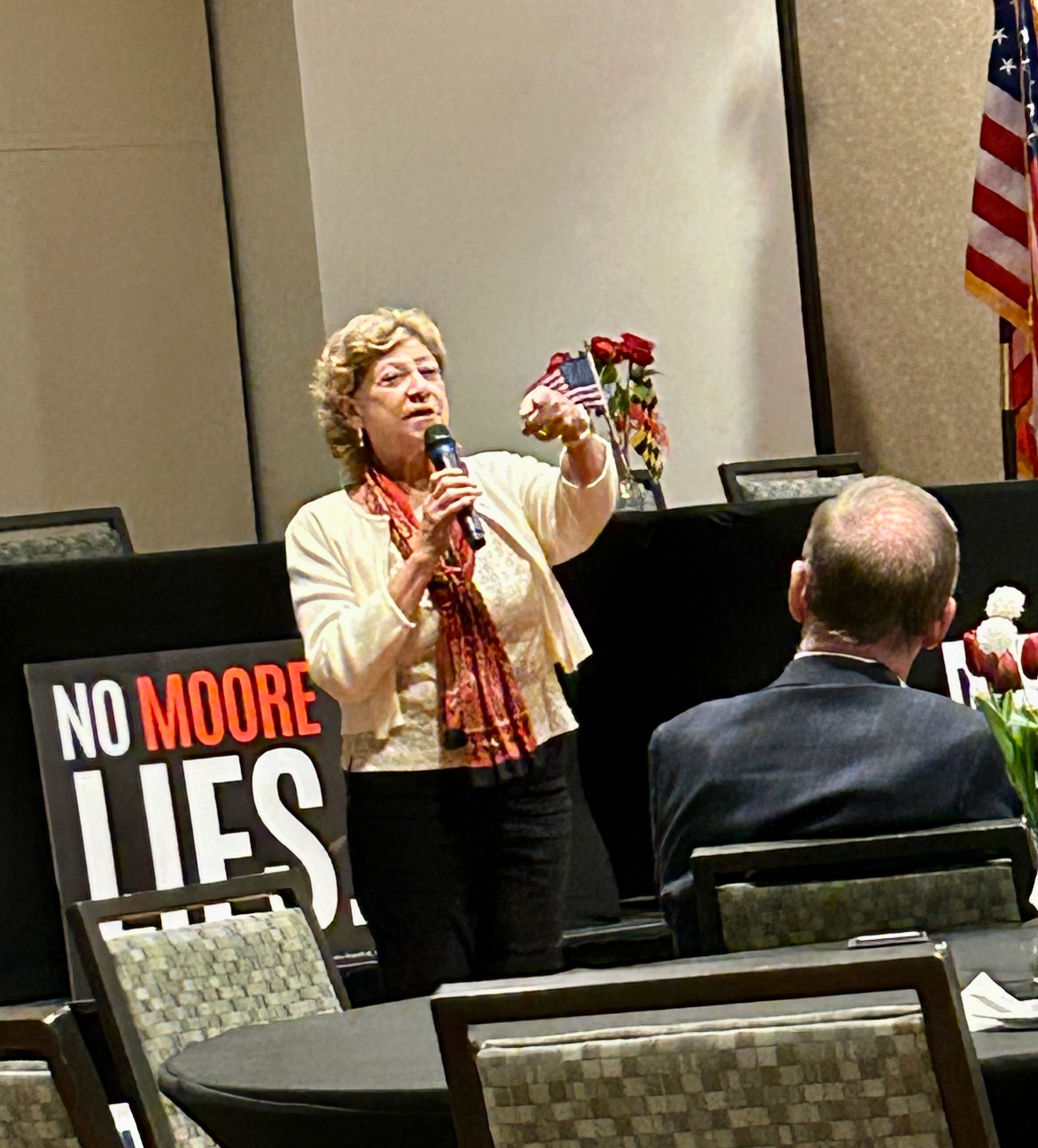Amy speaking at a public meeting